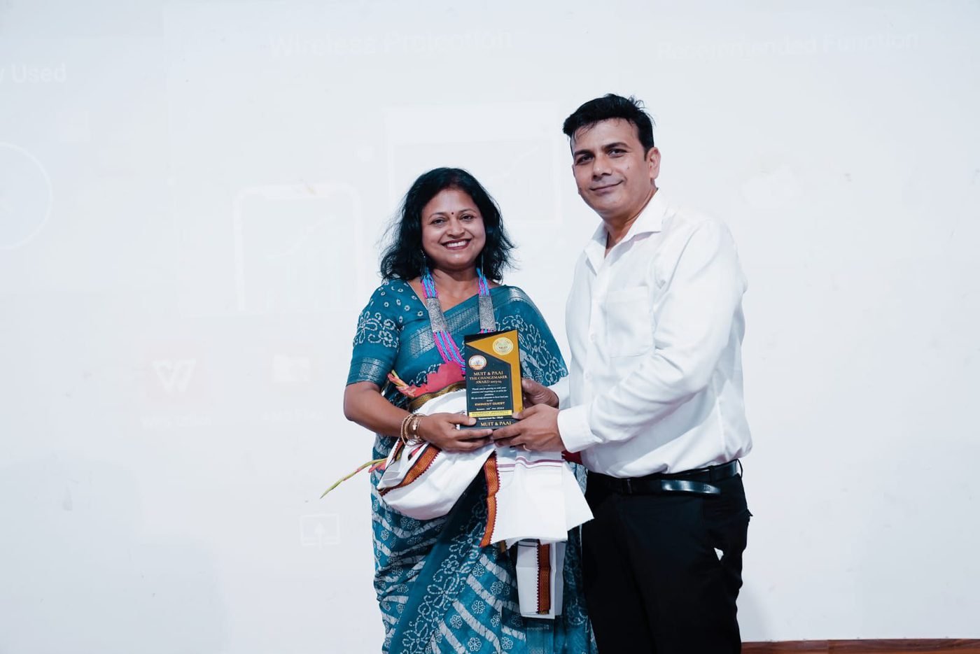 Receiving a trophy at an award ceremony
