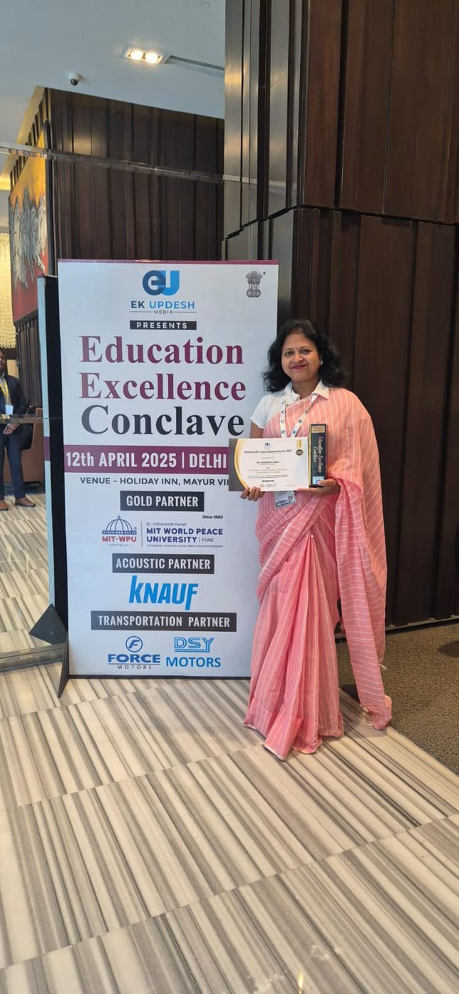 Holding a certificate at the Education Excellence Conclave in Delhi