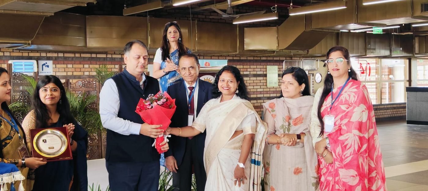 Group being felicitated with flowers at Gyankaksh, O.P. Jindal University