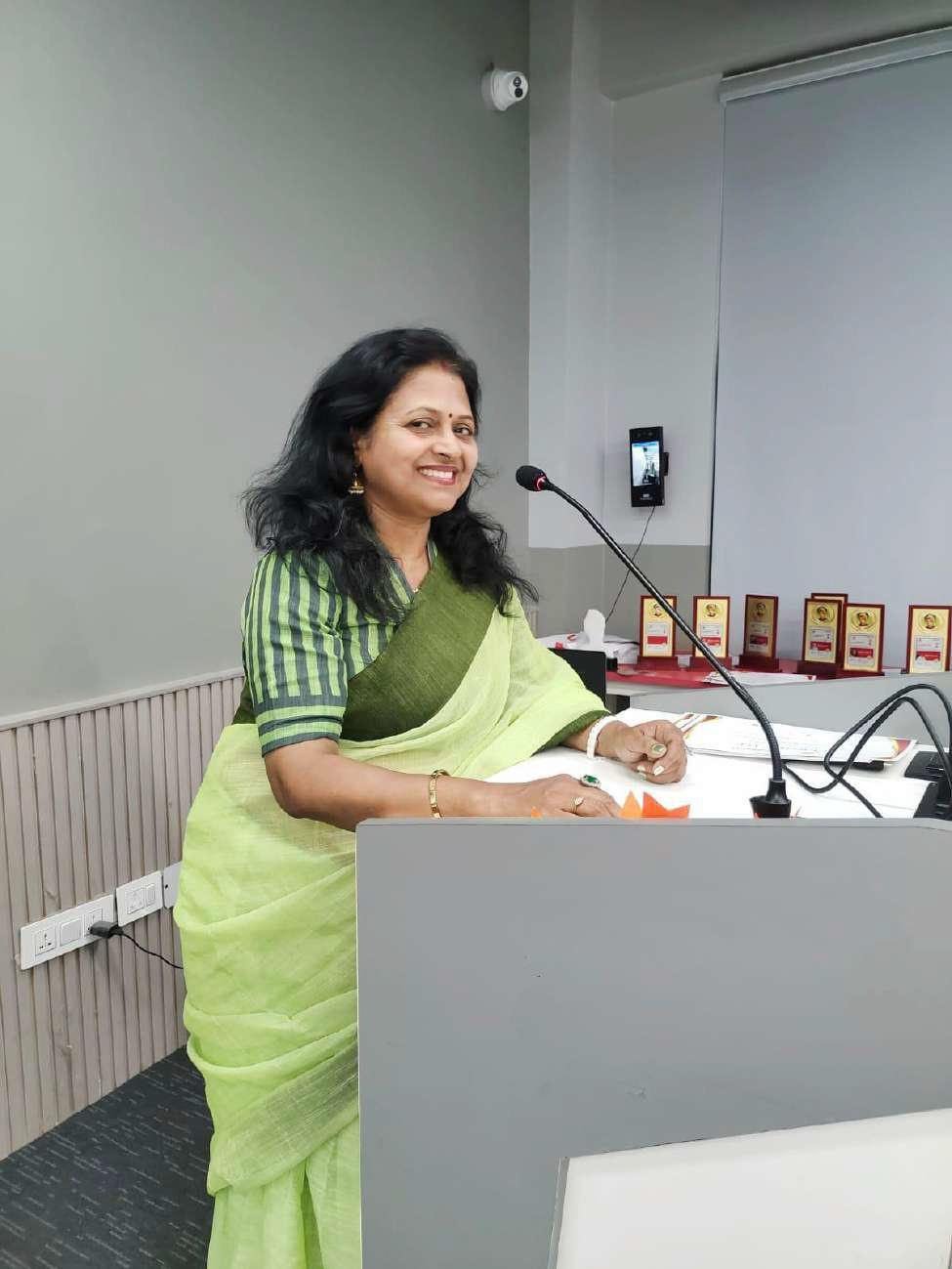 Mrs. Sangeeta Rani speaking at a podium at Rishihood University